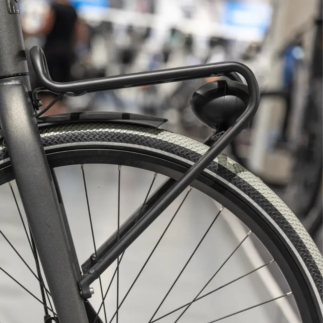 Close up of the rear wheel and frame details of the Cortina Common Family electric bike