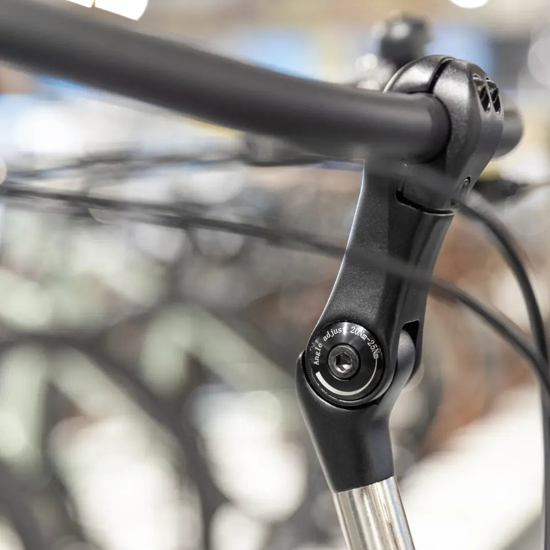 A close-up of the handlebar stem of the Cortina Common Family model electric bike