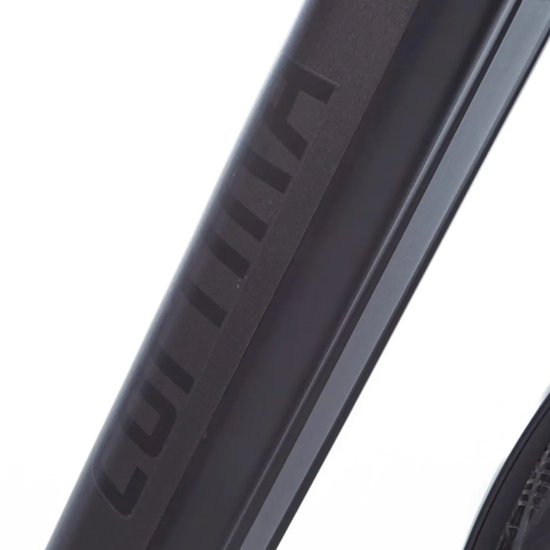 A close-up shot of the frame of the Cortina E Mozzo electric bike with a sleek black design