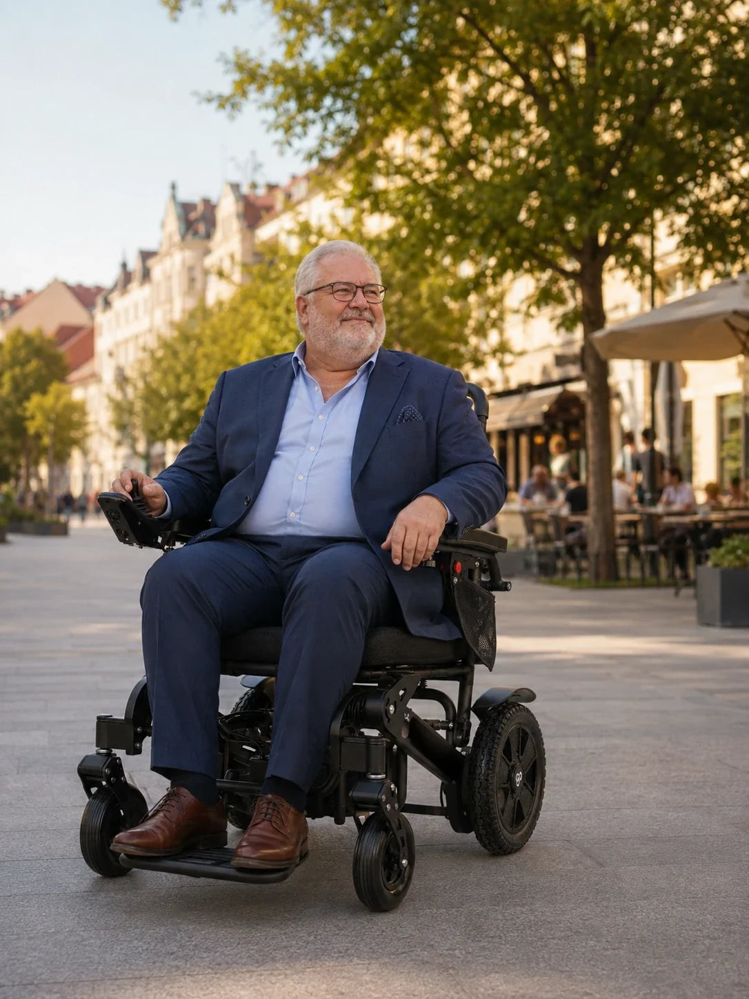Electric wheelchair ComfyGO Majestic 440 HD Plus – man in suit sitting in the chair on an urban street