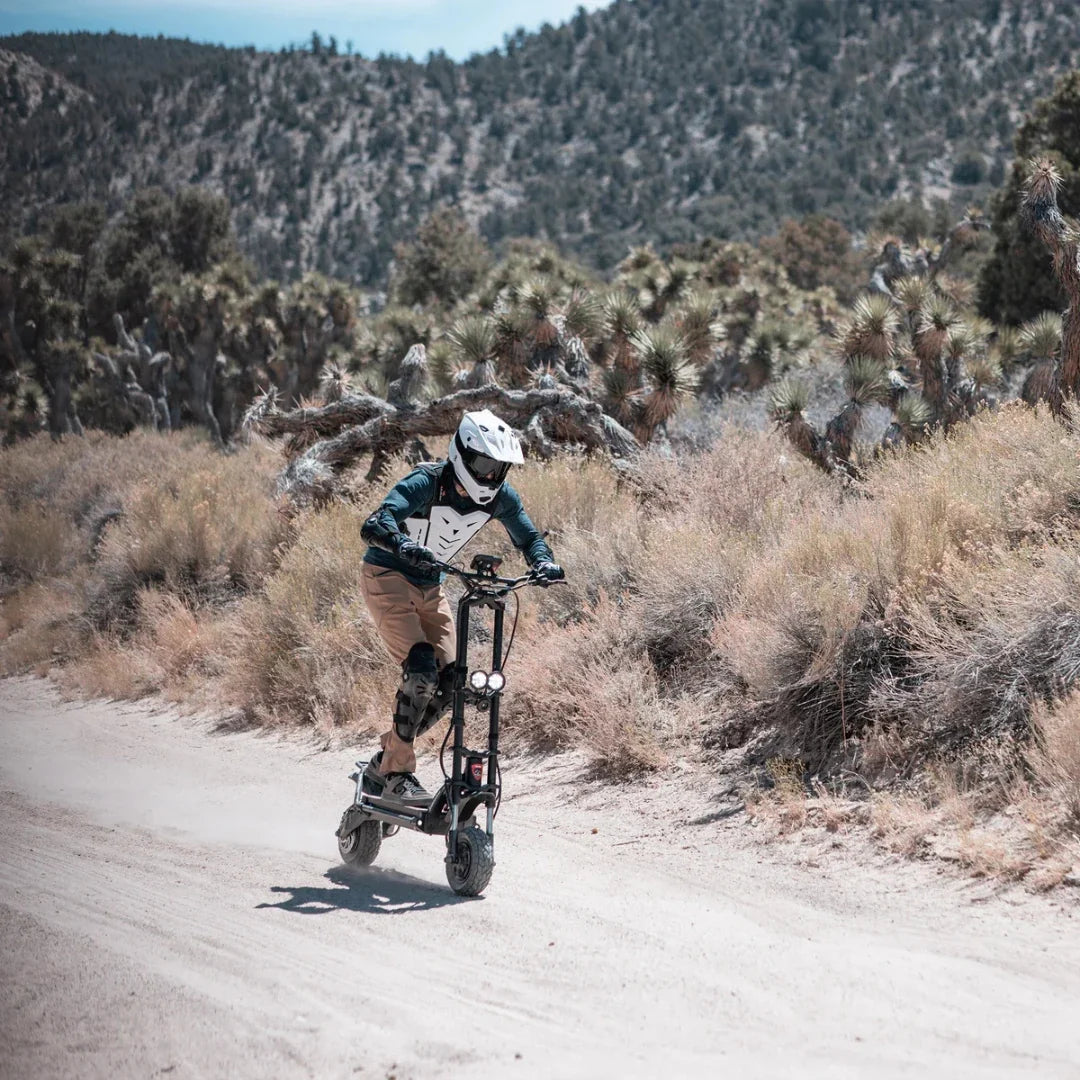 Electric scooter Kaabo Wolf Warrior 11 MAX – rider on dirt track