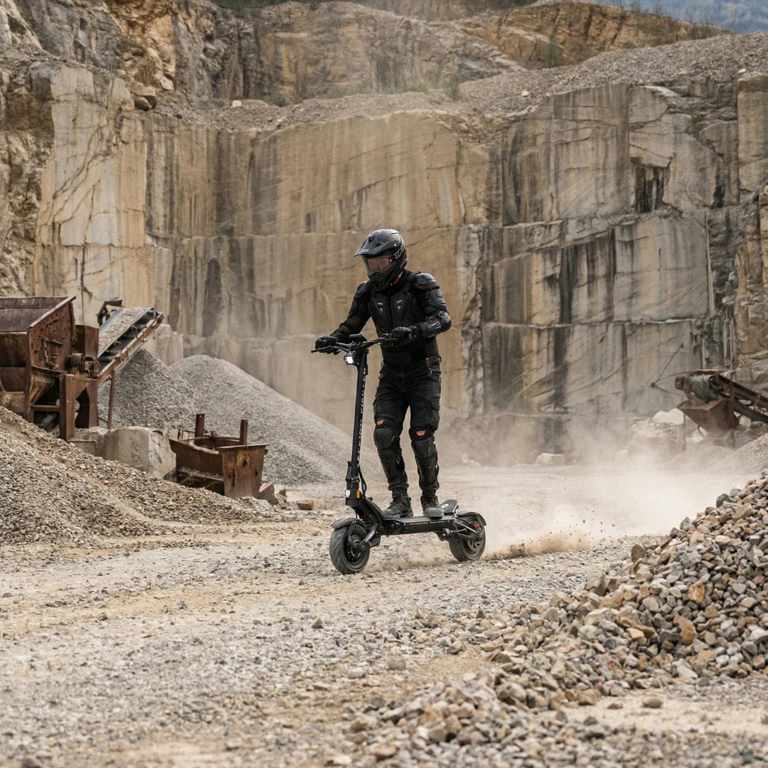 Electric scooter Teverun Fighter 11+ 2026 – rider in quarry, dusty ground