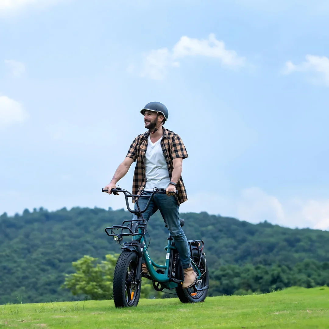 Electric Bike Engwe L20 Boost features a robust design, large tires, and a stylish rider in a scenic setting.