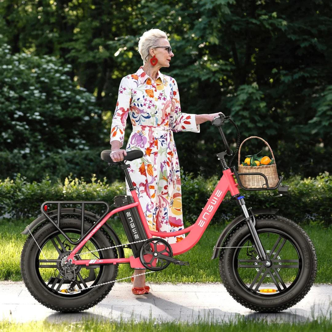 Electric Bike Engwe L20 features a stylish pink design, comfortable seat, and sturdy basket for groceries.