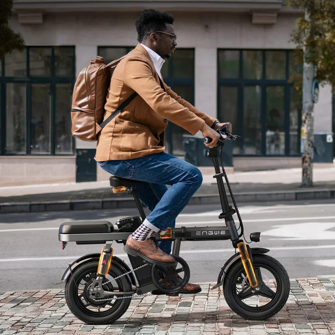 Electric Bike Engwe T14 features a compact design, stylish frame, and a rider on city streets.