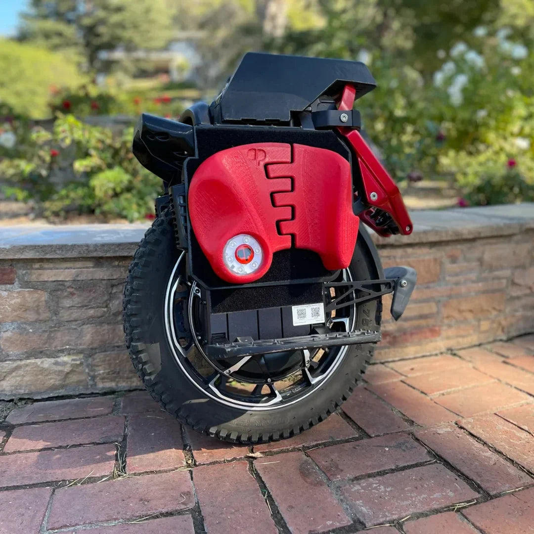 Electric unicycle KingSong S22 Pro – parked on brick patio, side view
