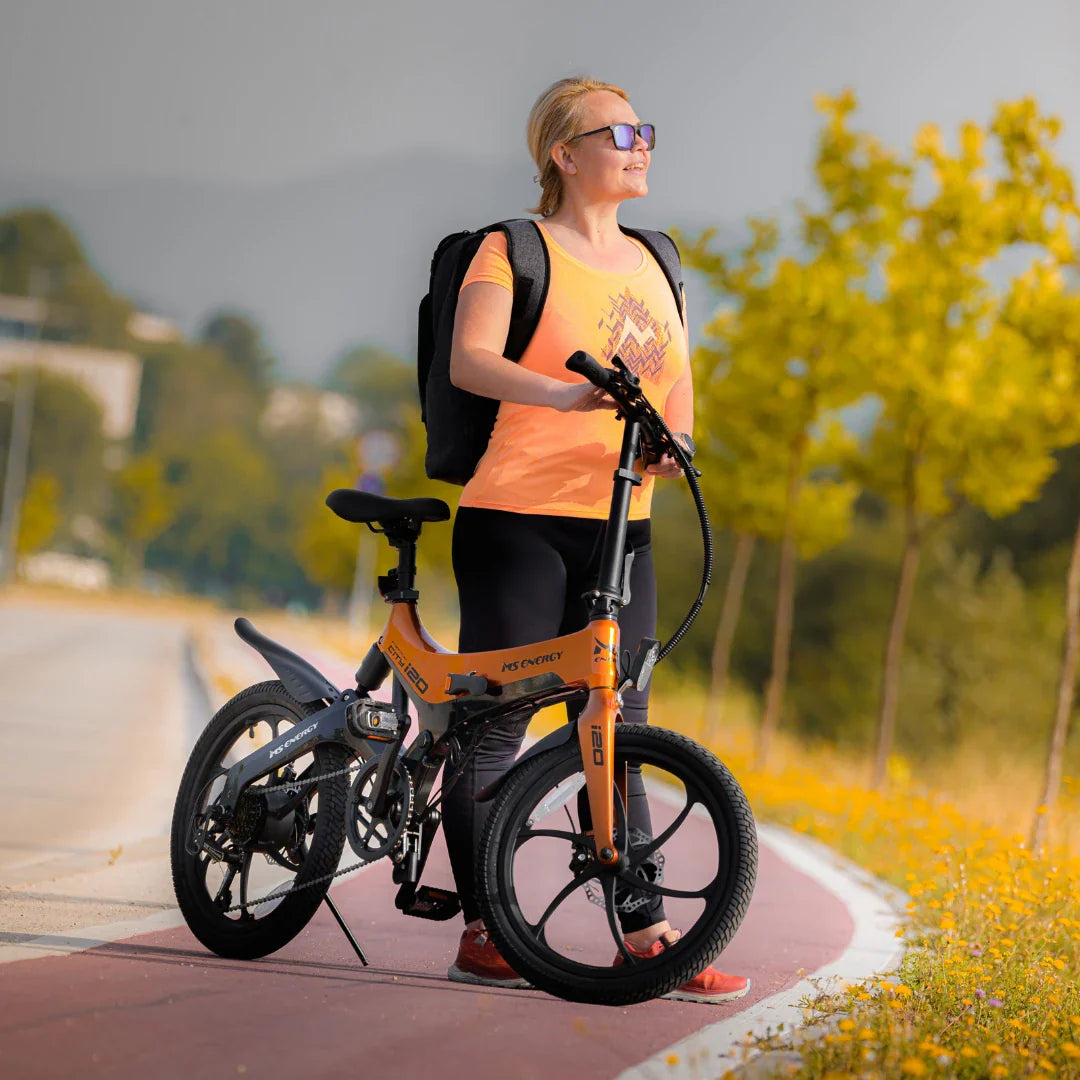 Electric Bike Ms Energy I20 features a stylish orange frame, perfect for commuting or leisure rides.