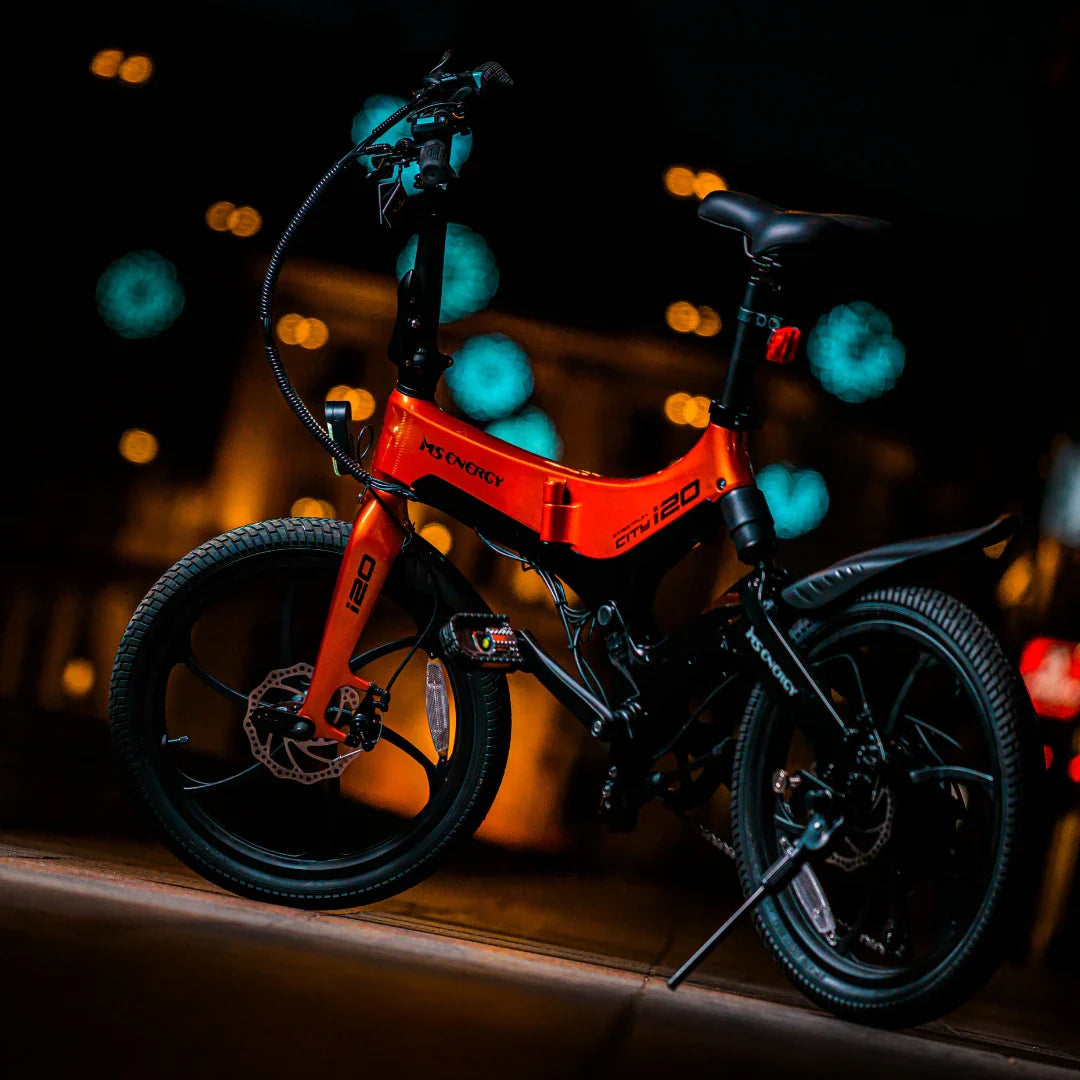 Electric Bike Ms Energy I20 features a striking orange frame, compact design, and sturdy tires for urban rides.