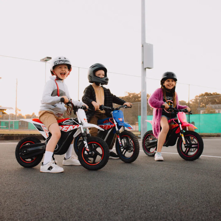 Three kids ride electric bikes, including the Electric Bike Apollo Olala Sx E500, on the track