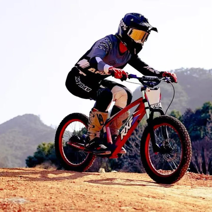 A rider on an Apollo Evo Racing 18 electric bike rides on a dirt track