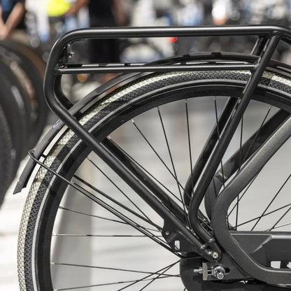 Close-up of the rear wheel and trunk of the Cortina Common Family electric bike