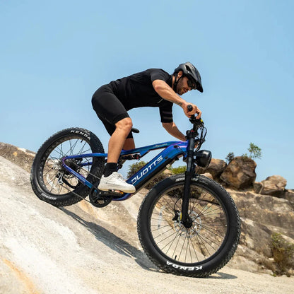 Electric Bike Duotts E26, robust design, wide tires, suitable for off-road adventures, rider in action.