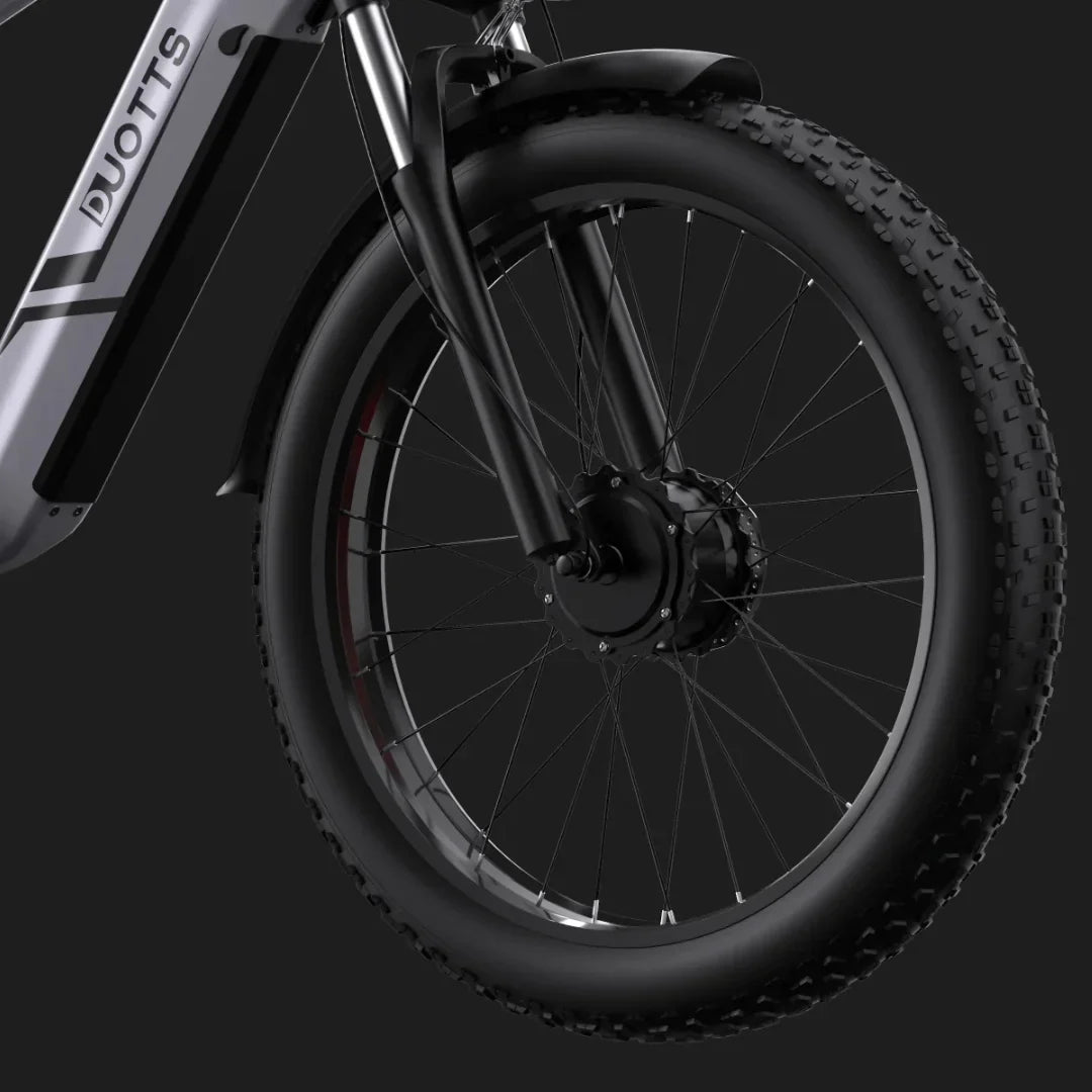 Electric Bike Duotts F26 features a robust front wheel with a powerful motor hub and durable tires.