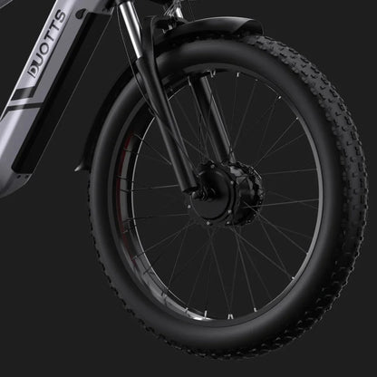 Electric Bike Duotts F26 features a robust front wheel with a powerful motor hub and durable tires.