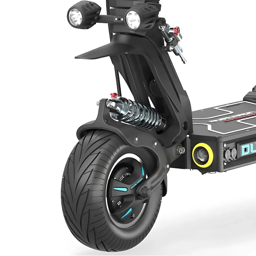A close-up shot of the Dualtron X Limited electric scooter showing the tire and suspension system