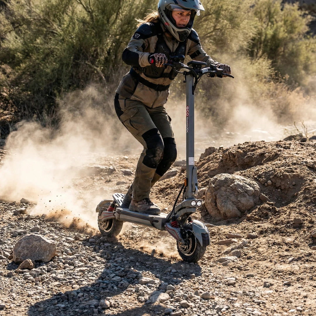Electric scooter ECO Speed 10X V2 – woman riding off-road, kicking up dust