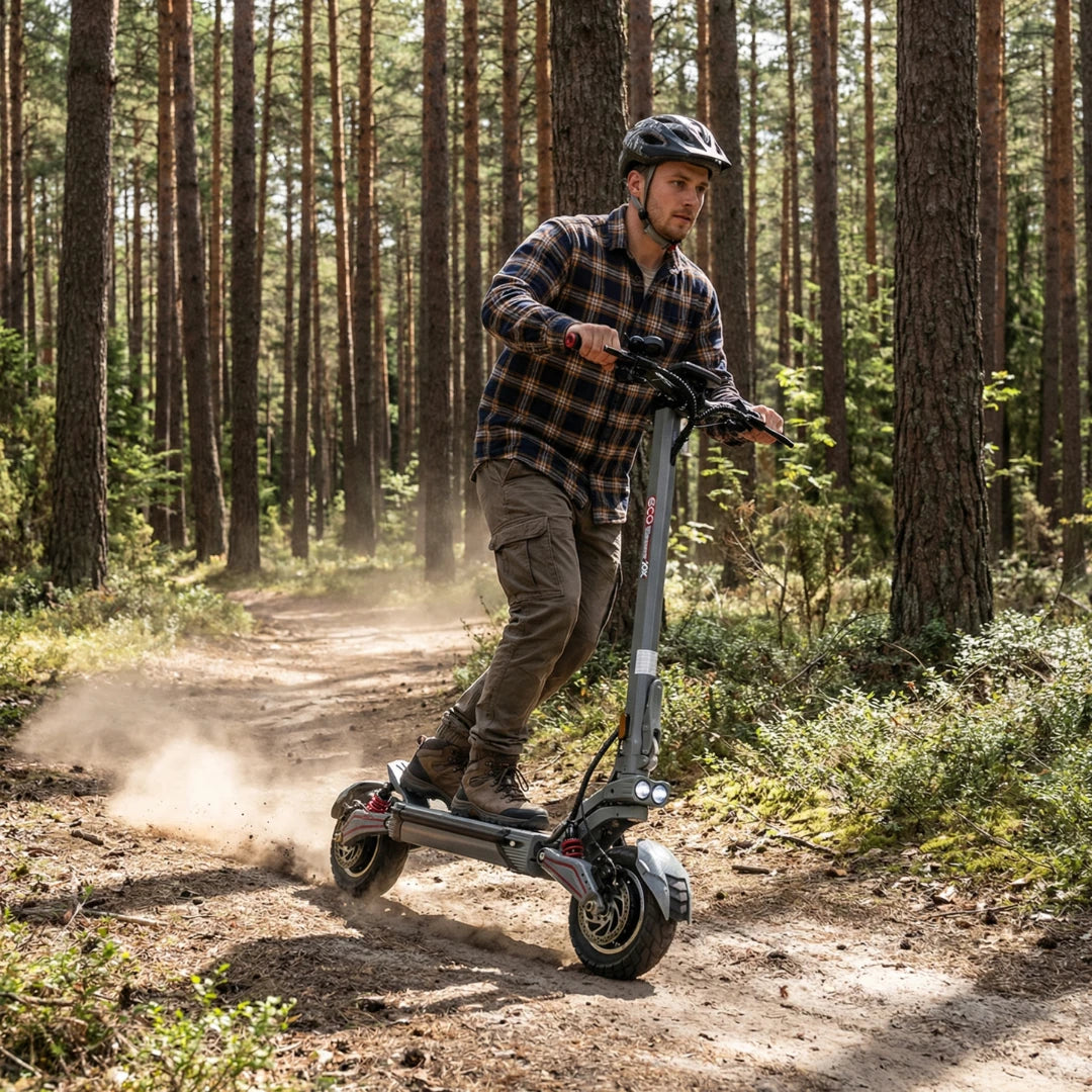 Electric scooter ECO Speed 10X V2 – man riding on dirt path through forest