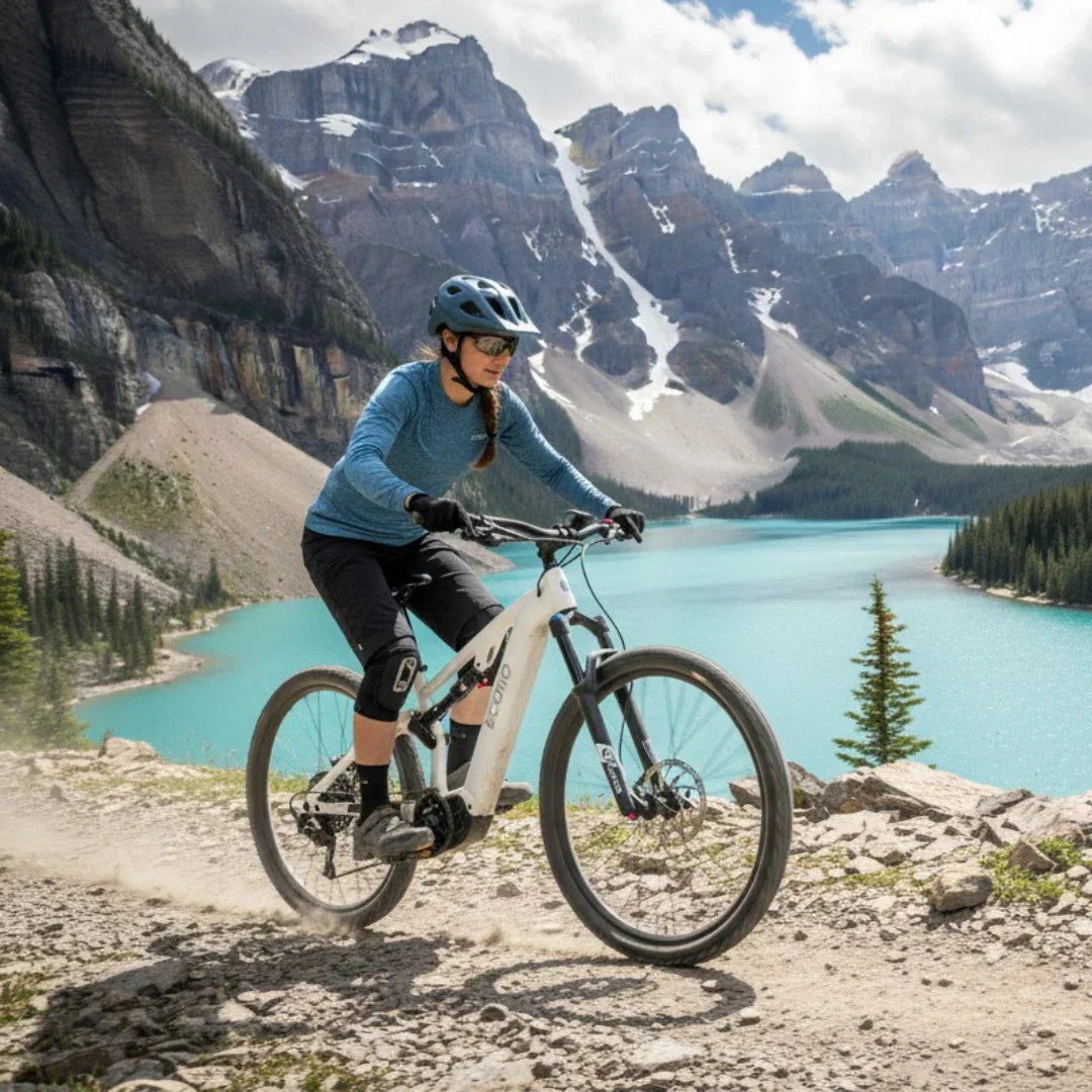 Electric bicycle ECONO Pantera C9 160 – rider on rocky trail, mountain lake
