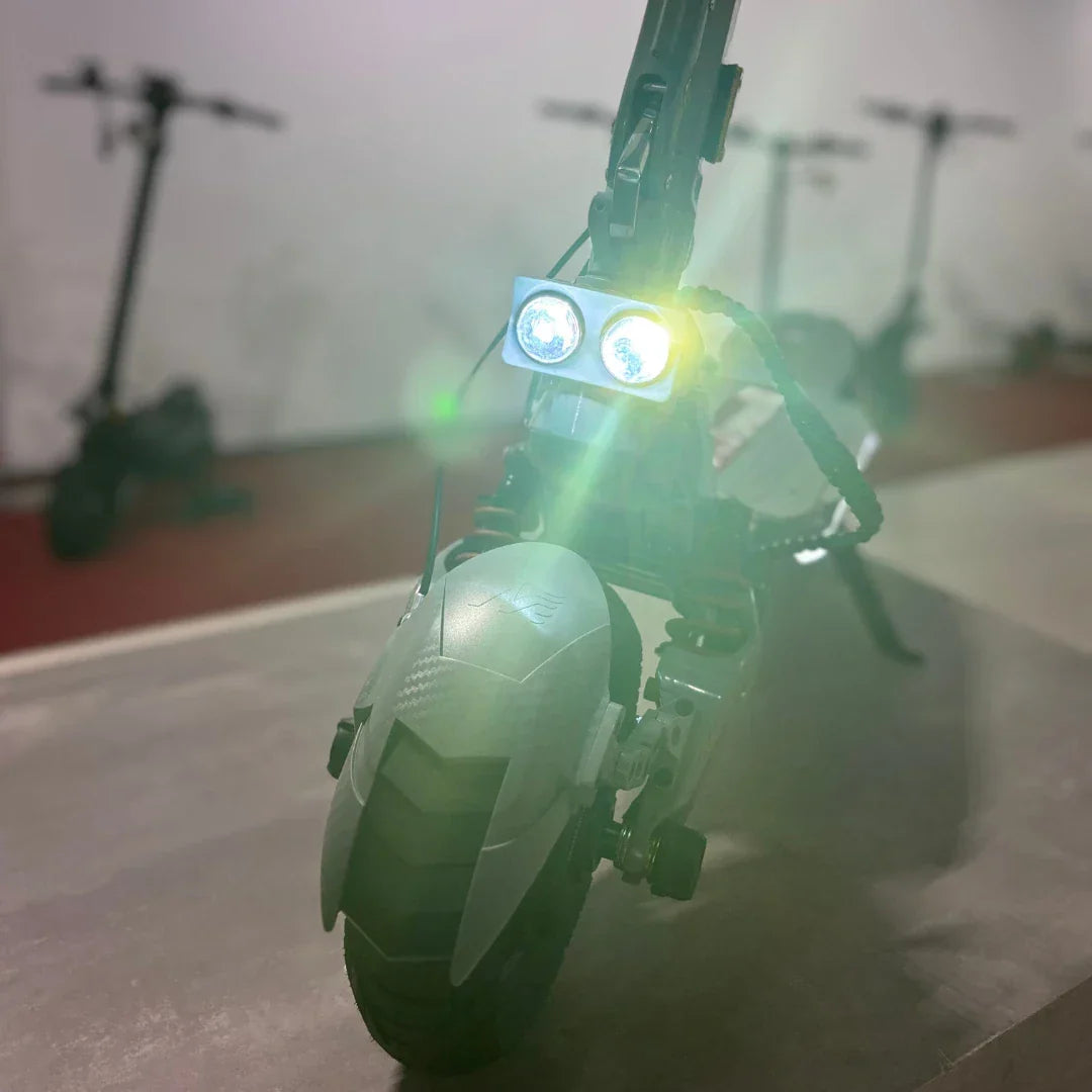 Electric scooter ECO Speed 10X V2 – front view with headlights on