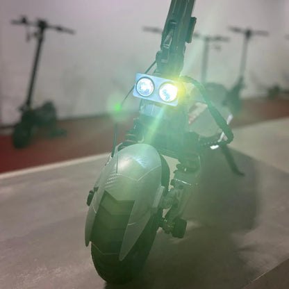 Electric scooter ECO Speed 10X V2 – front view with headlights on