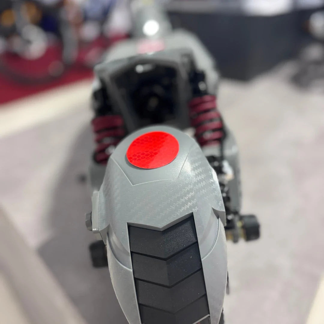 Electric Scooter Eco Speed 10x V2 features a sleek design with a textured gray body and red accents, smooth tire.