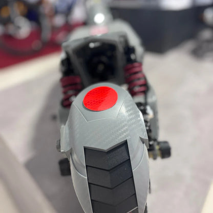 Electric Scooter Eco Speed 10x V2 features a sleek design with a textured gray body and red accents, smooth tire.