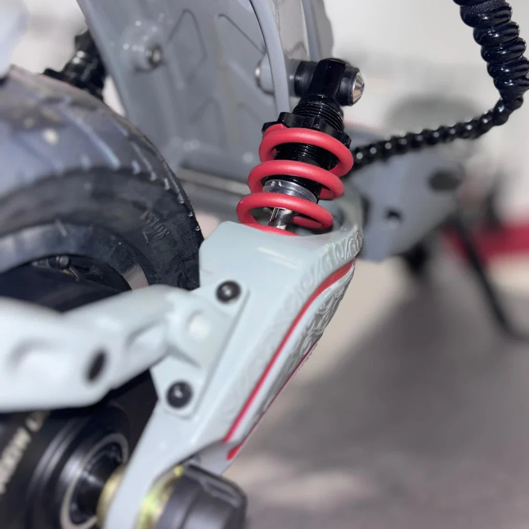 Electric Scooter Eco Speed 10x V2 features a robust rear suspension with red coil springs, offering excellent shock absorption.
