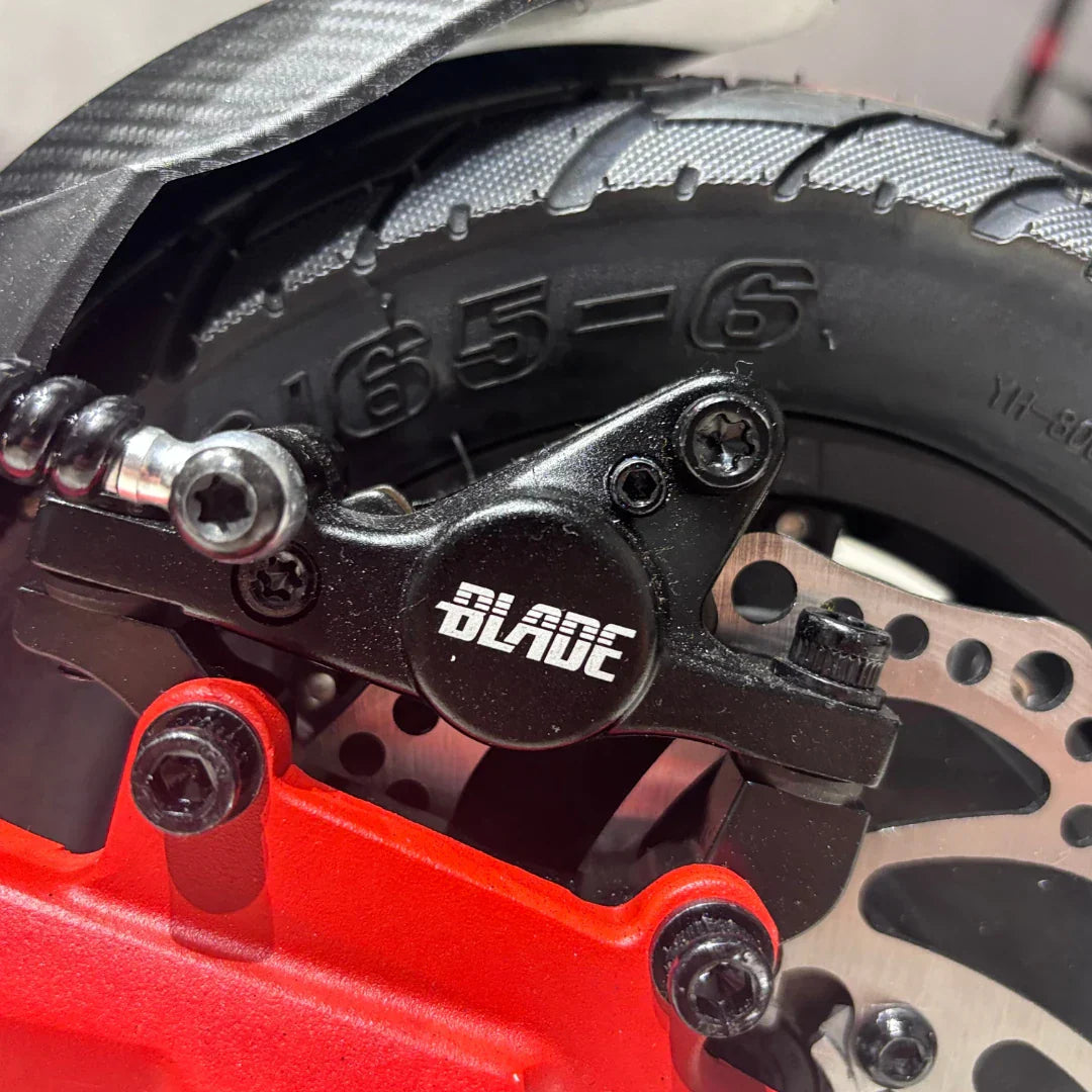 Electric scooter ECO Speed 9X – rear brake caliper and disc close-up