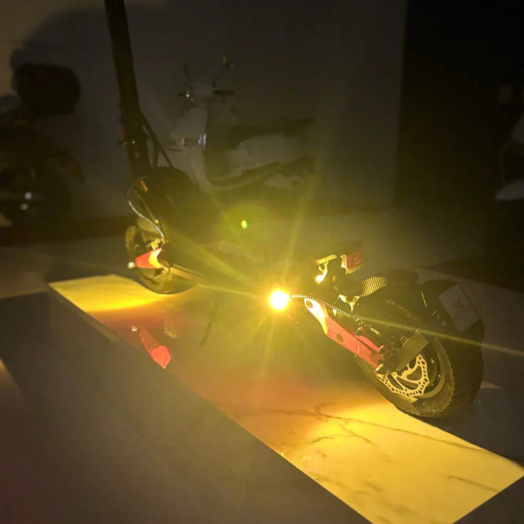 Electric scooter ECO Speed 9X – rear view, yellow lights on