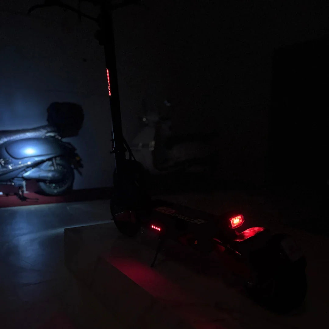 Electric Scooter Eco Speed 9x features a sleek design with illuminated accents for visibility at night.