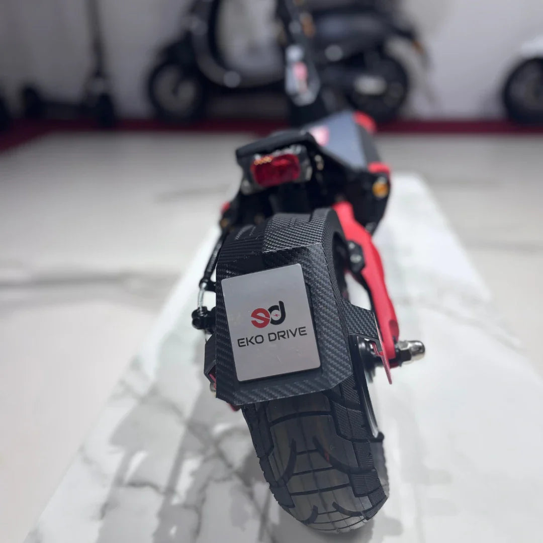 Electric Scooter Eco Speed 9 features a sleek design with red accents, sturdy tires, and a textured grip.