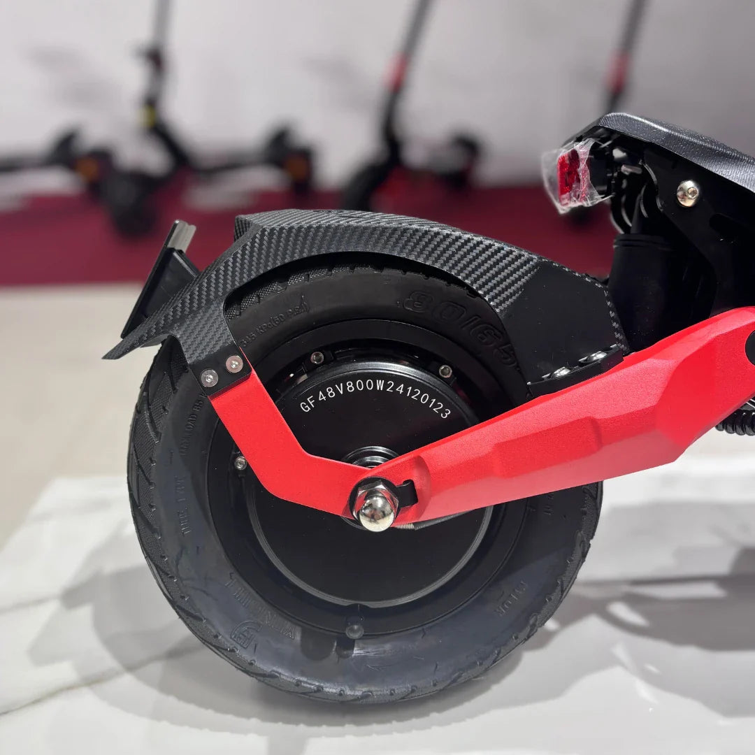 Electric Scooter Eco Speed 9 features a durable tire, sleek carbon fiber fender, and vibrant red arm.