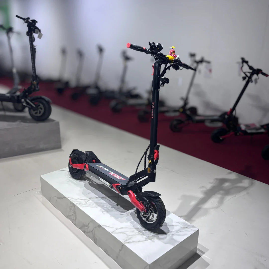 Electric Scooter Eco Speed 9 features a sleek black and red design, with sturdy tires and a stylish build.