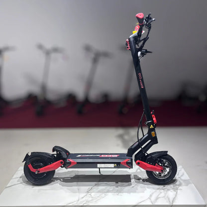 Electric Scooter Eco Speed 9 features a sleek design, red accents, sturdy frame, and front suspension for a smooth ride.