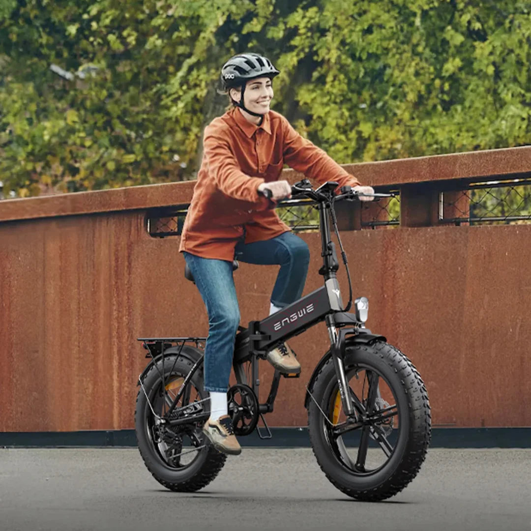 Electric Bike Engwe Ep 2 Pro, stylish folding e-bike with fat tires, rider in casual attire enjoys outdoor ride.