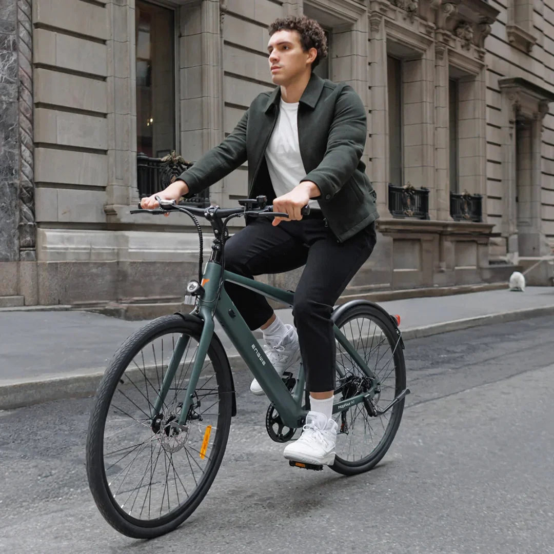 Electric Bike Engwe Mapfour N1 Air features a sleek design, rider in casual attire, cruising on city streets.