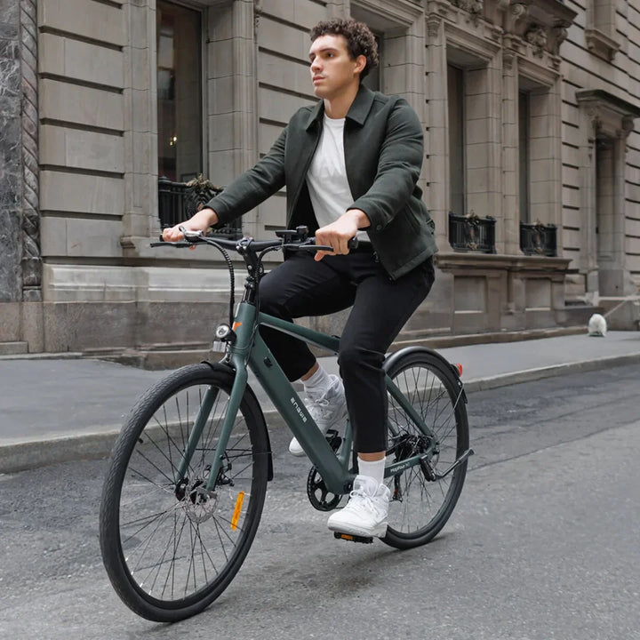 Electric Bike Engwe Mapfour N1 Air features a sleek design, rider in casual attire, cruising on city streets.