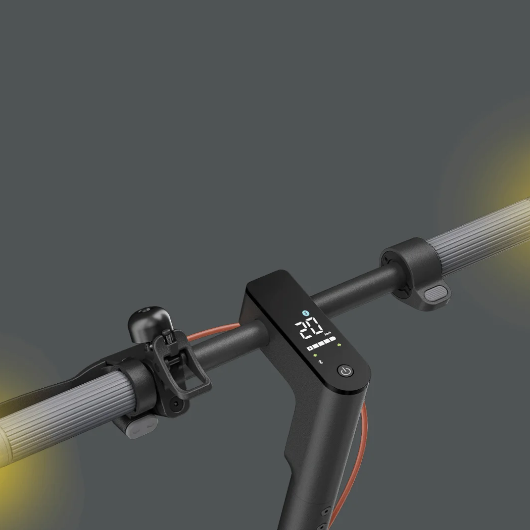 Alt text: Close-up of the handlebar of the Electric Scooter Xiaomi 5, featuring a digital display and bell.
