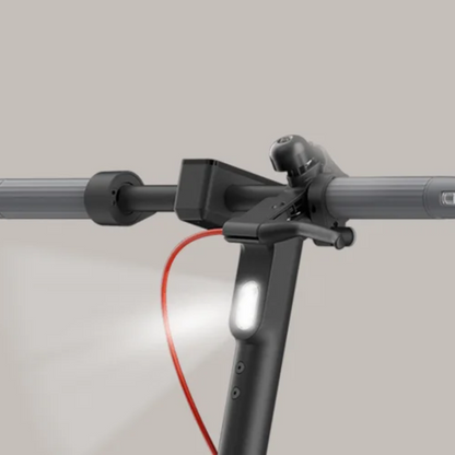 Electric Scooter Xiaomi 5 features a sleek handlebar with integrated light and bell for safety.