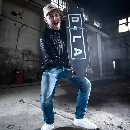Electric Skateboard Dila Pro features a sleek design, held by an excited individual in an industrial setting.