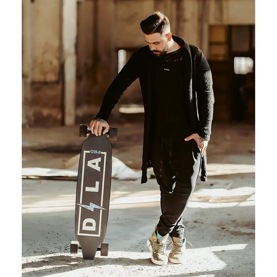 Electric Skateboard Dila Pro, stylish design with black and white graphics, held by a man in casual attire.