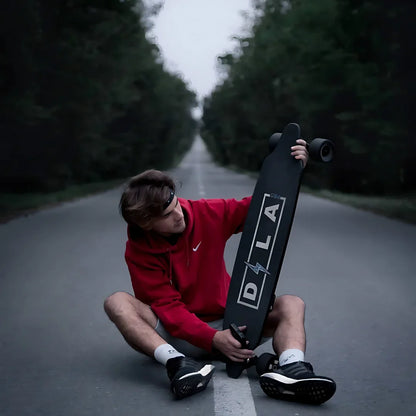 Electric Skateboard Dila Off features a sleek design in black, as a person inspects it on a quiet road.