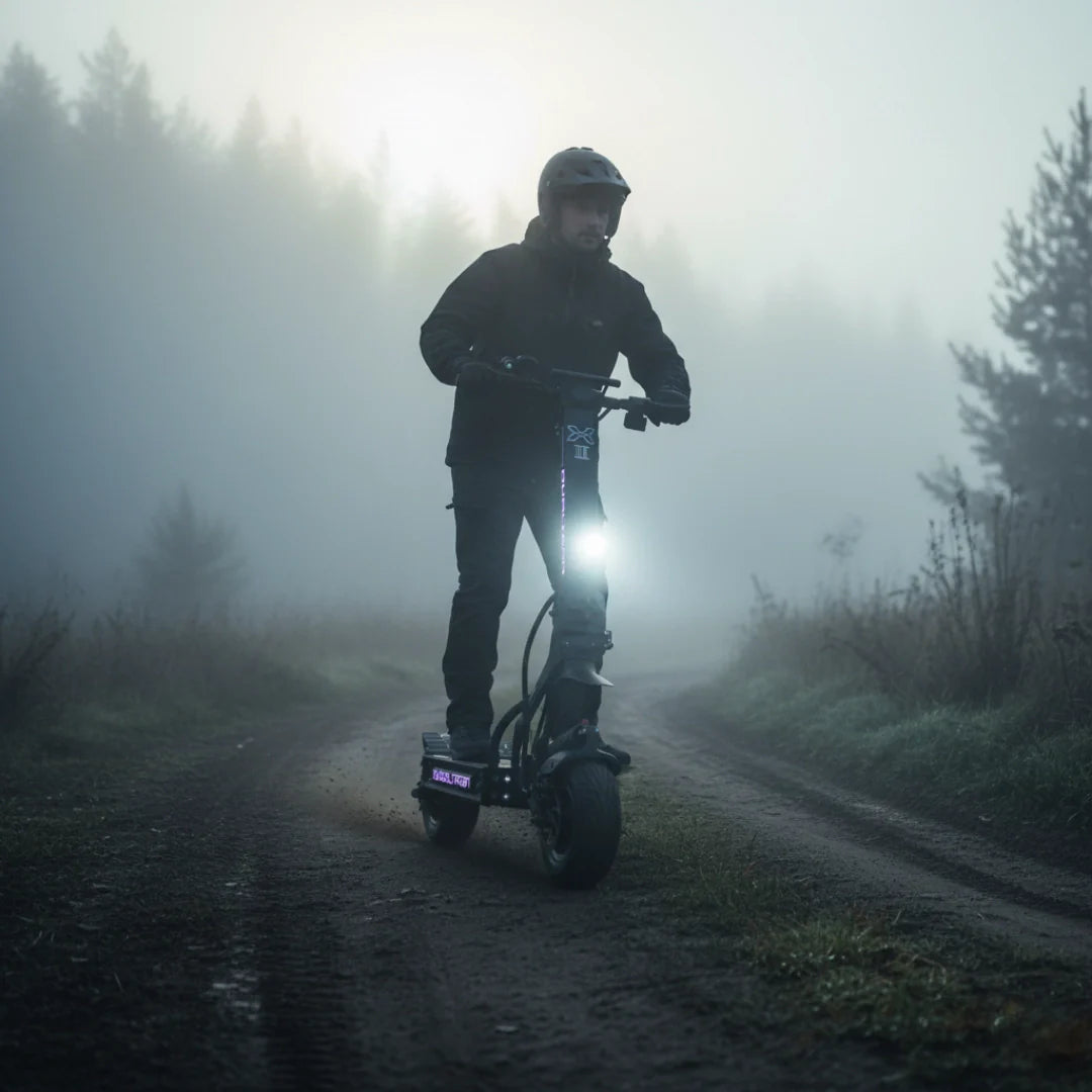 Electric scooter Dualtron X2 UPGRADE – man riding scooter in foggy forest