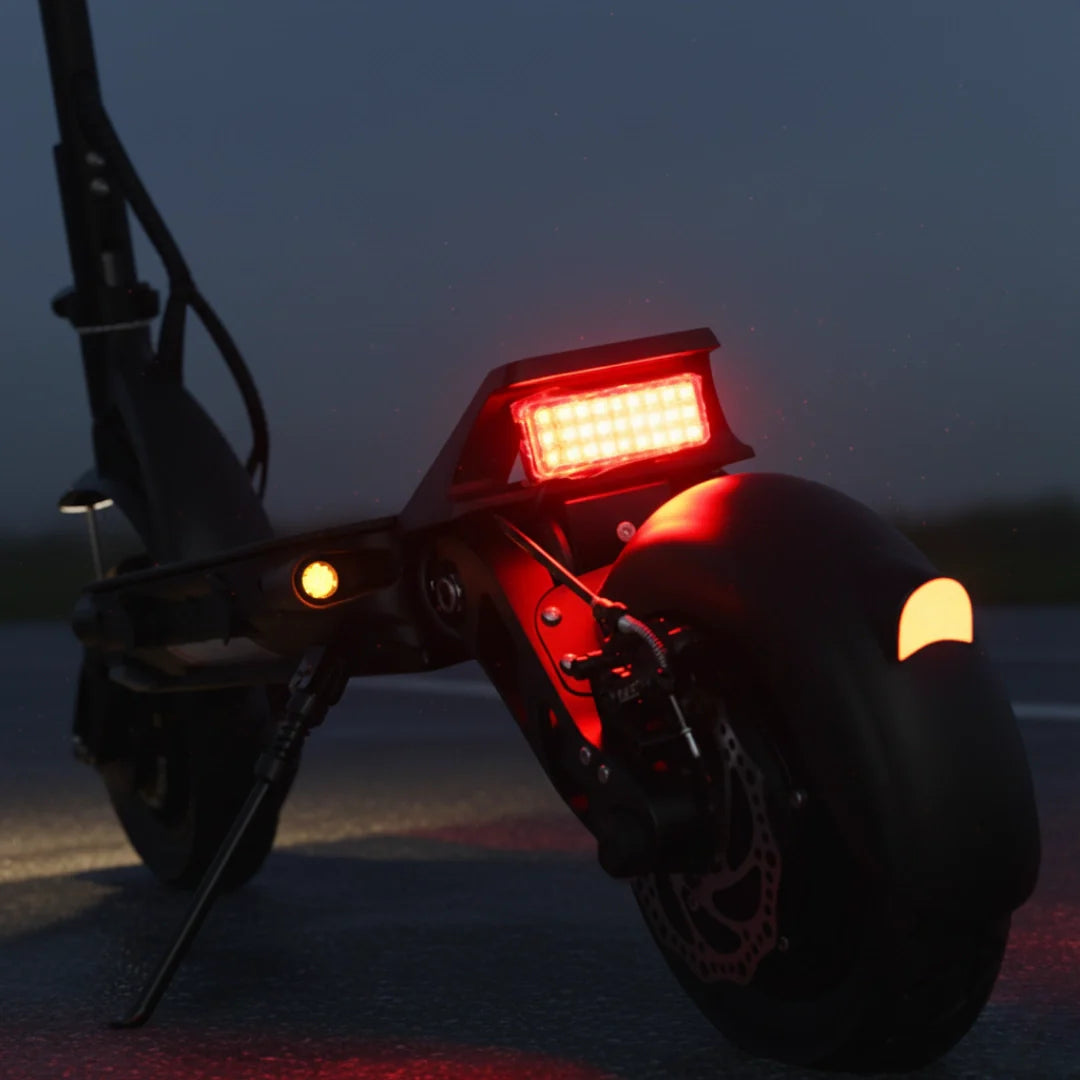 Electric scooter Dualtron Forever – rear lights illuminated at night