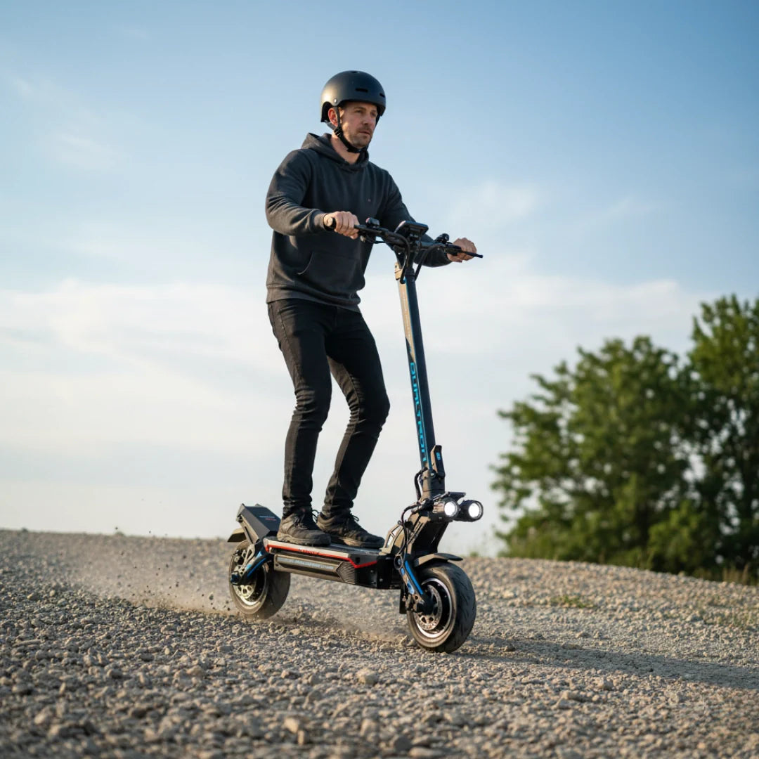 Electric scooter Dualtron Storm Limited – person riding on a gravel path