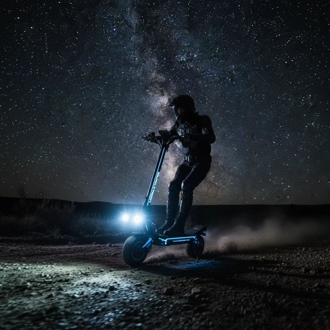 Electric scooter Dualtron Storm Limited – person riding at night under milky way