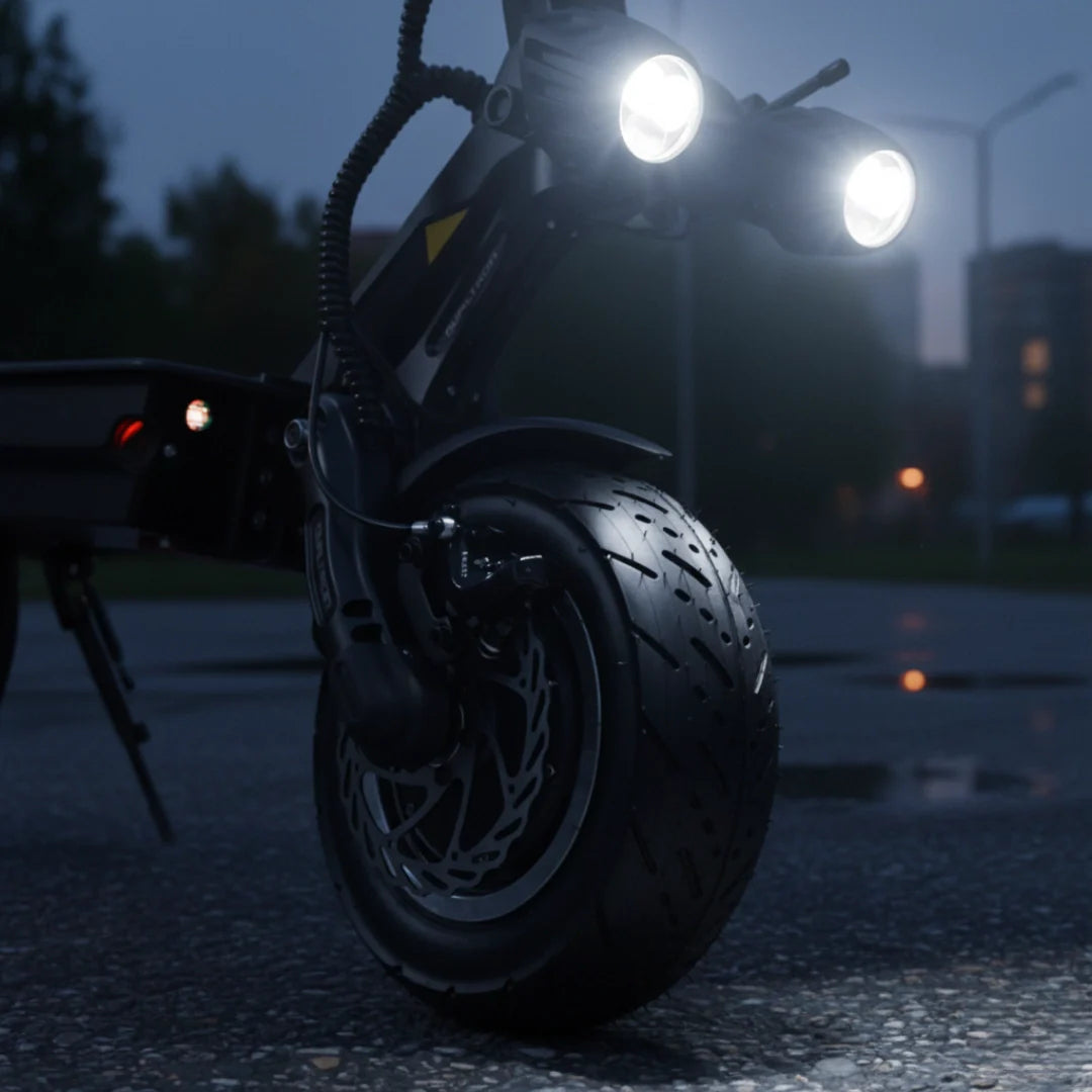 Electric scooter Dualtron Thunder 3 – front wheel and illuminated headlights at night