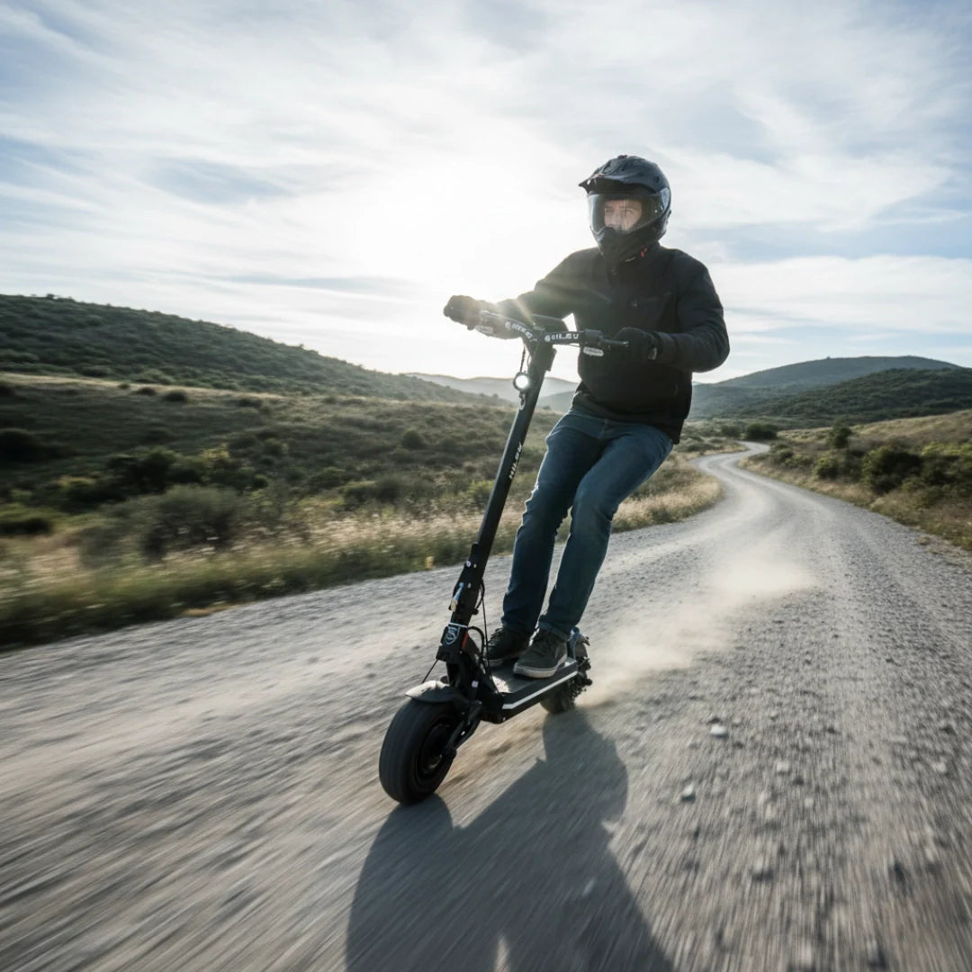 Electric scooter Hiley TIGER SUPRA – rider on dirt road, sunny day