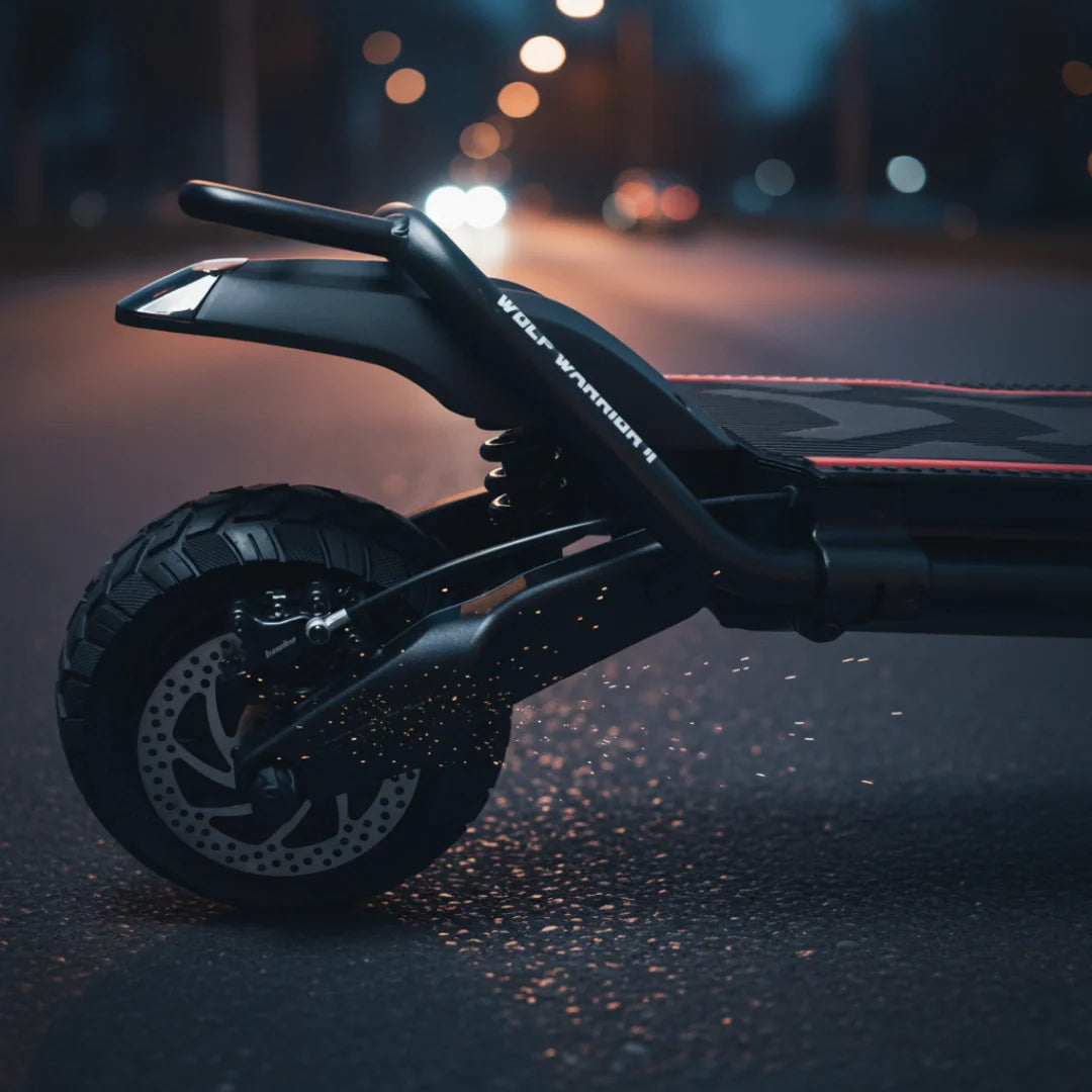 Electric scooter Kaabo Wolf Warrior 11 MAX – rear wheel and suspension on wet road