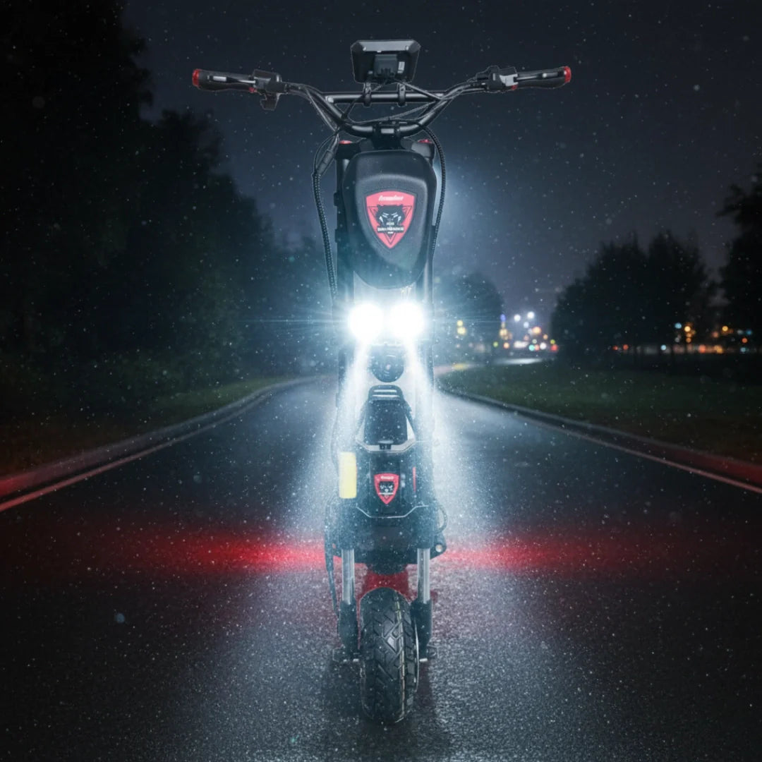 Electric scooter Kaabo Wolf Warrior 11 MAX – front view with headlights on at night